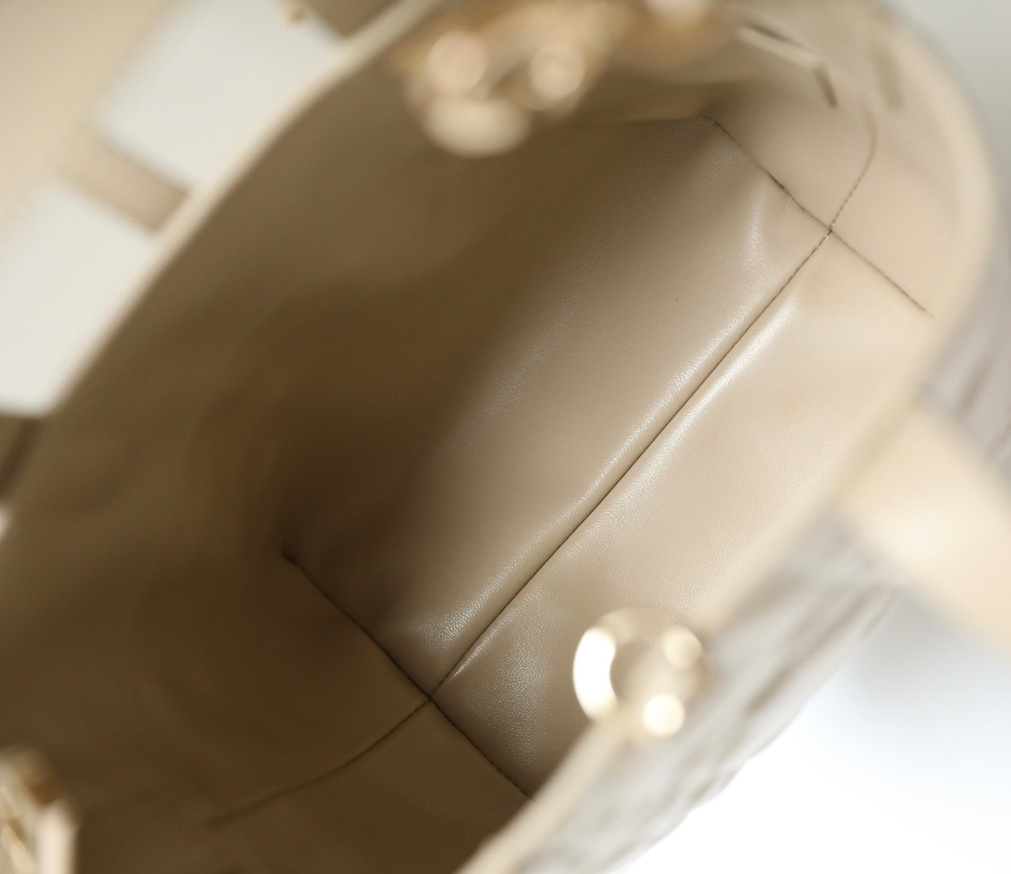 Unveil Luxury with Beige Quilted Handbag