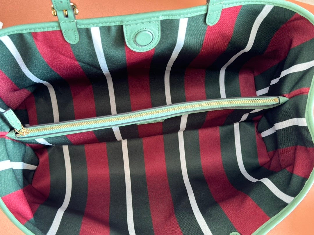 Light green shopping tote bag with GG pattern