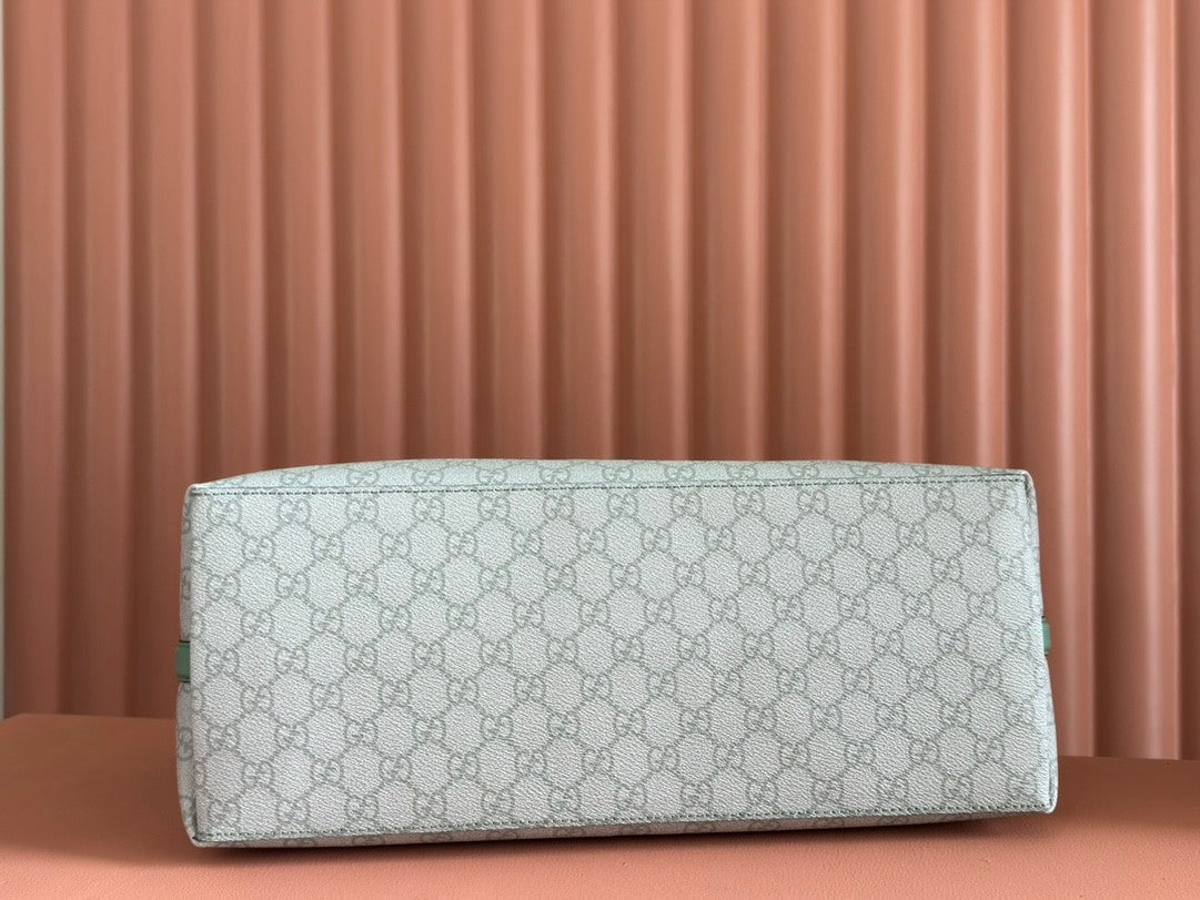 Light green shopping tote bag with GG pattern