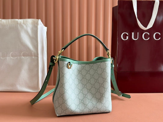 Mini light green bucket handbag with GG pattern