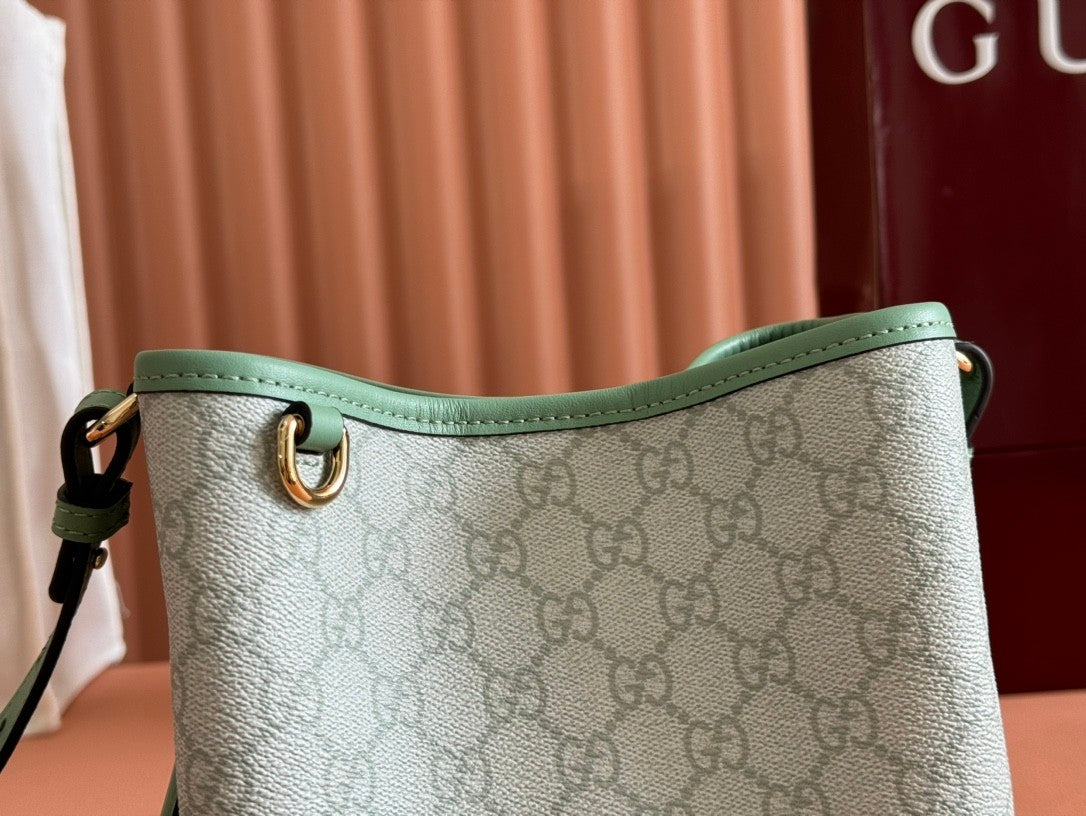 Mini light green bucket handbag with GG pattern