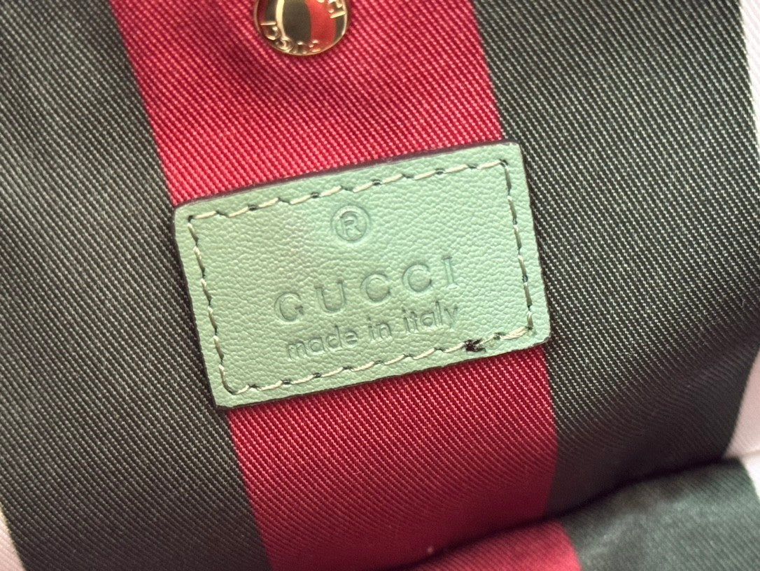 Mini light green bucket handbag with GG pattern