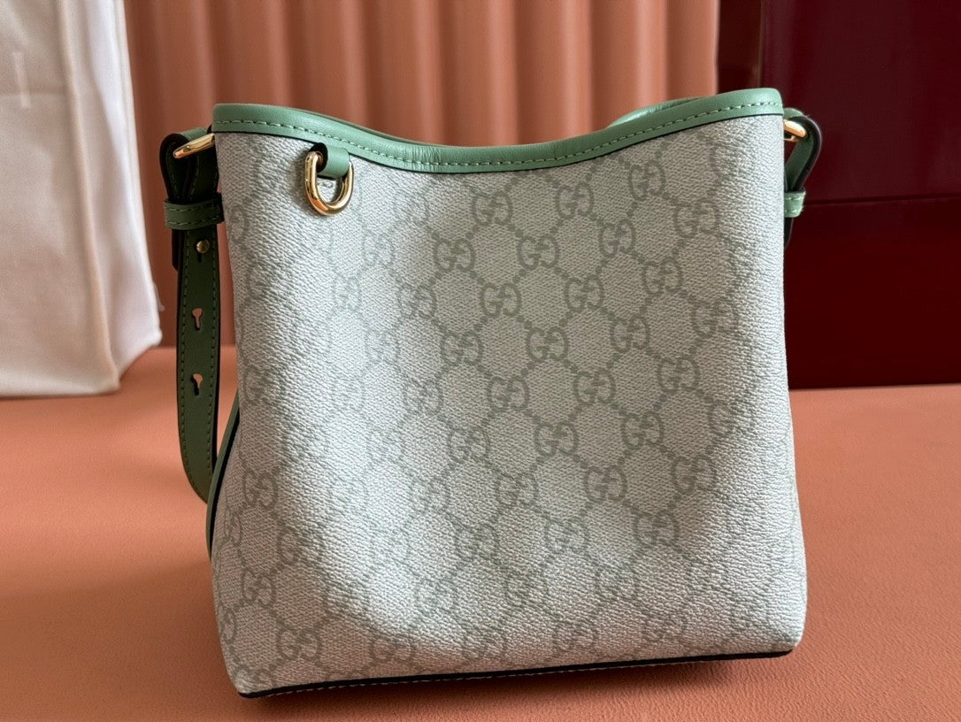 Mini light green bucket handbag with GG pattern