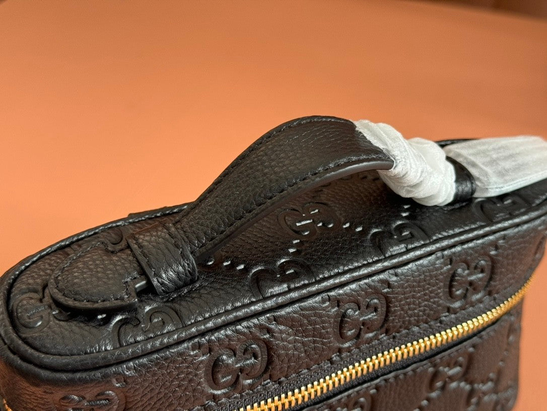 Black embossed handbag