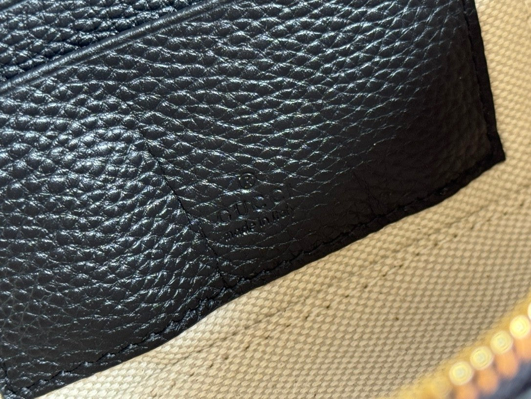 Black embossed handbag