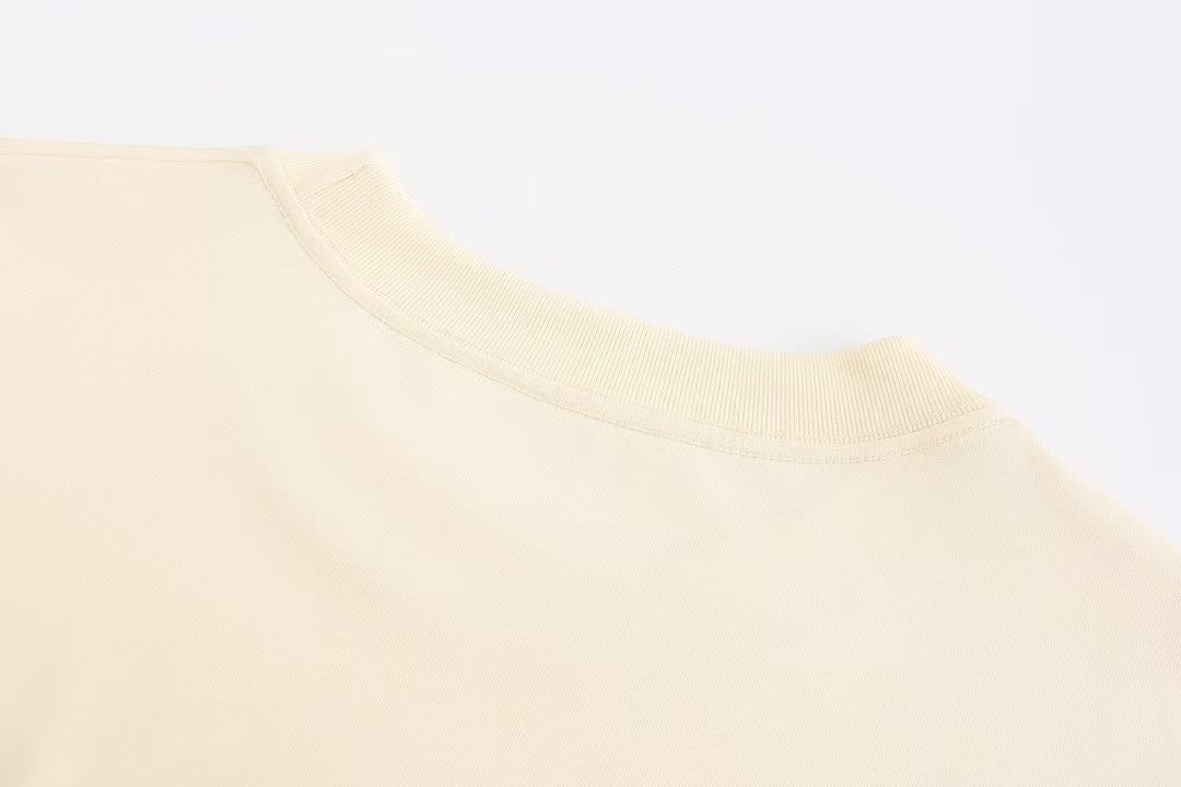 Chic and Quirky: Inspired Beige T - Shirt with Adorable Cartoon Prints