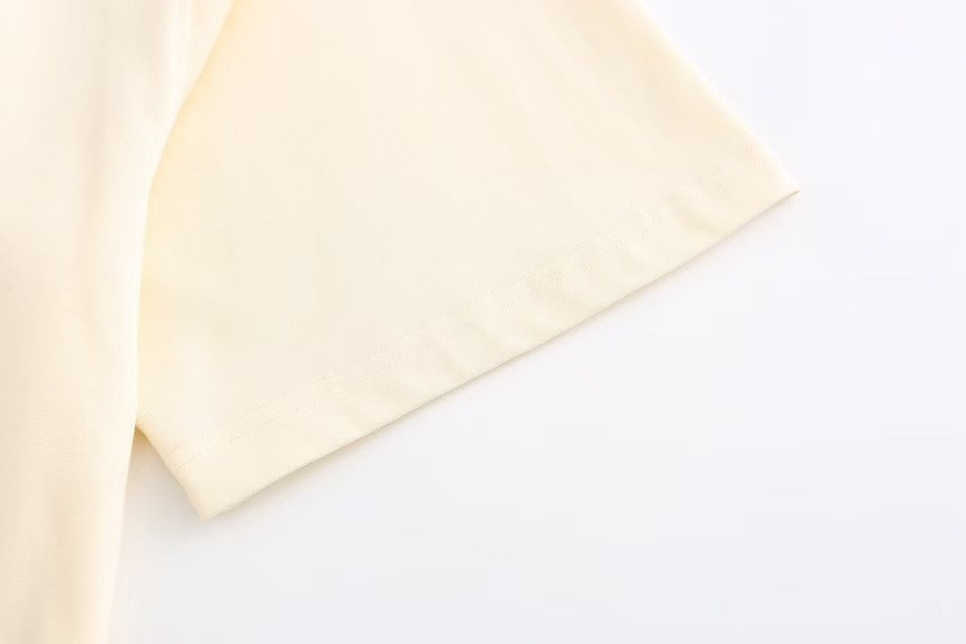 Chic and Quirky: Inspired Beige T - Shirt with Adorable Cartoon Prints