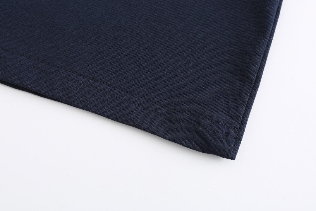 Navy blue T - shirt with an adorable snake and the GG logo. Unisex.