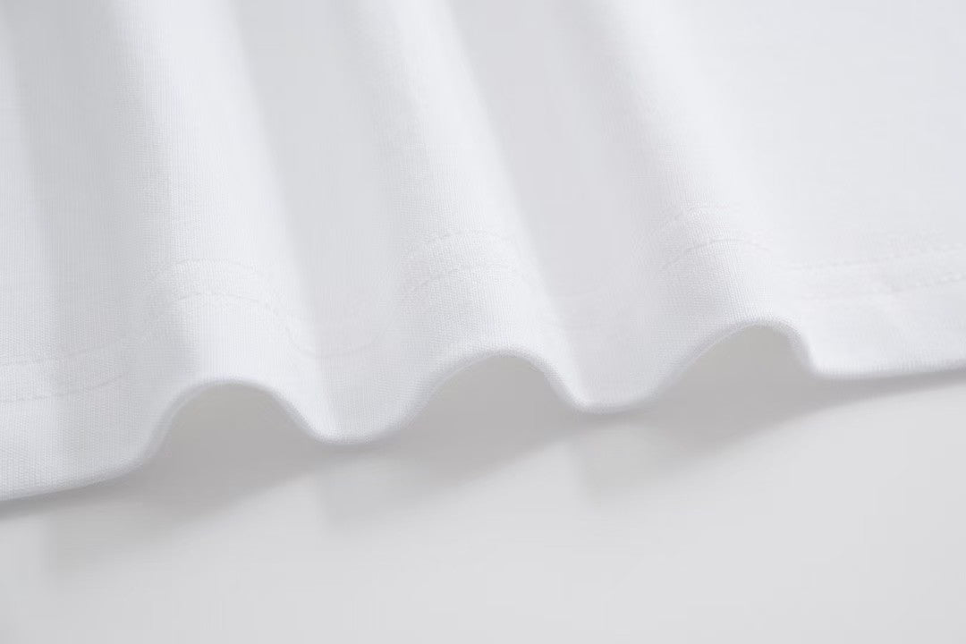 White T - shirt with an adorable snake and the GG logo. Unisex.