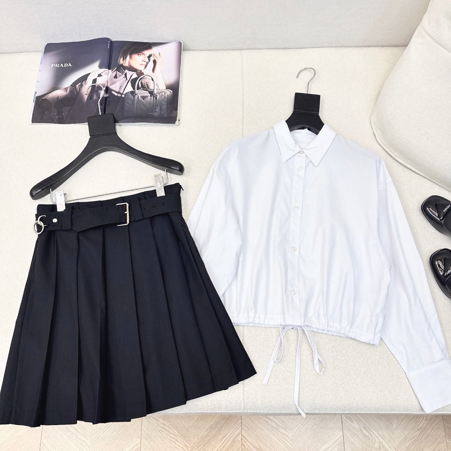 Pleated A - line skirt with classic belt embellishment