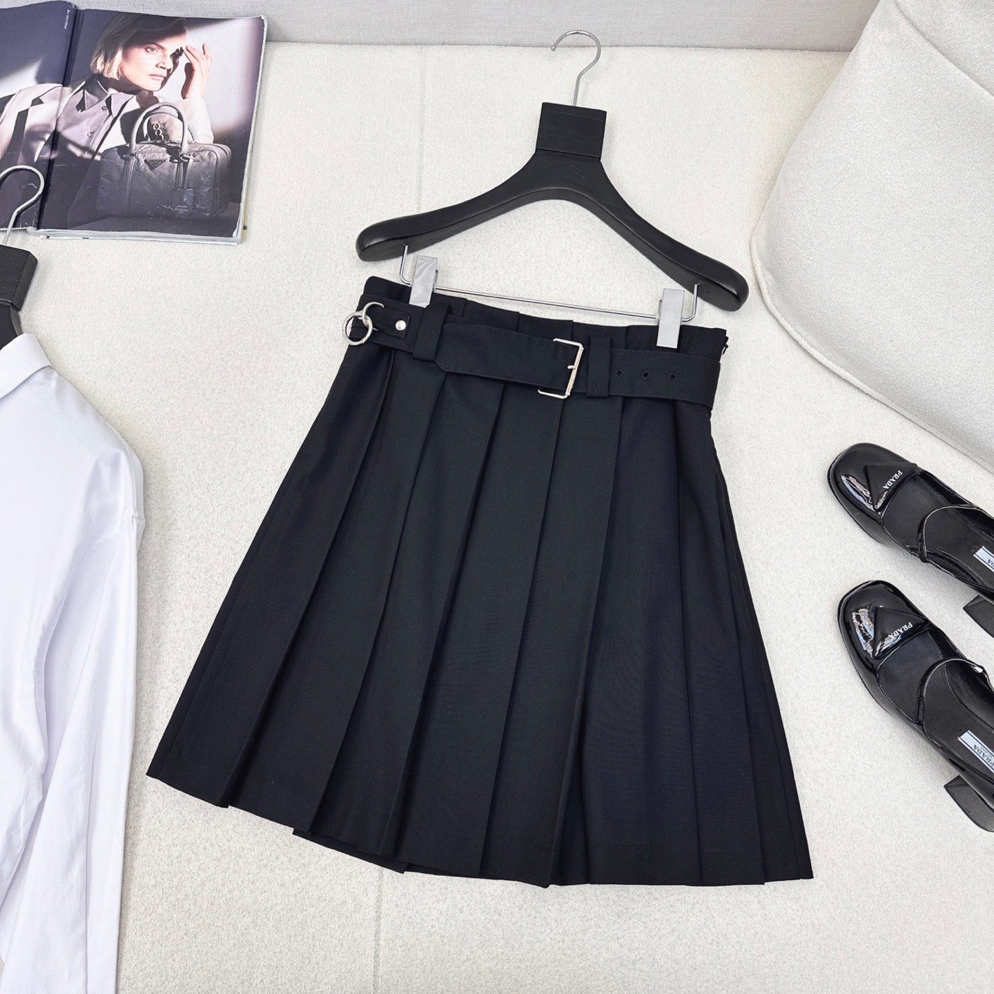 Pleated A - line skirt with classic belt embellishment