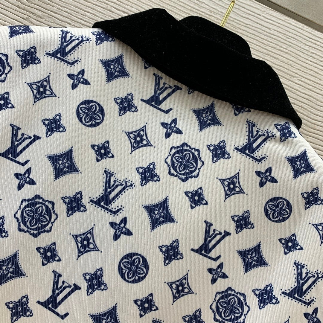 Sleeveless dress with letter logo prints, half - zippered front placket, and contrast - colored convertible collar