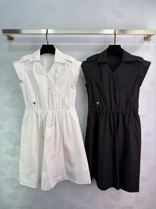Dress with notched collar, small V - neck, ruffled sleeves and a cinched waist. Made of custom - sourced, pure cotton material.