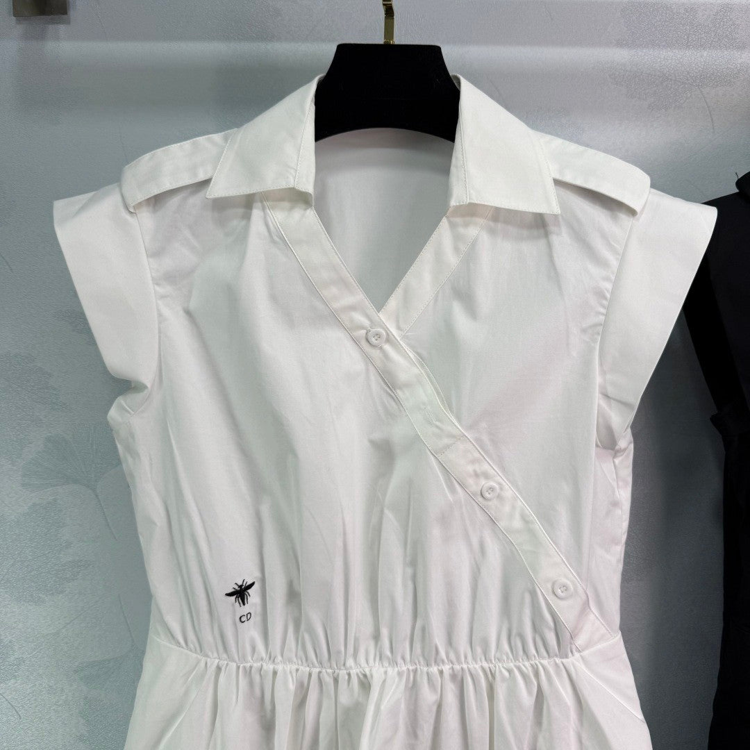 Dress with notched collar, small V - neck, ruffled sleeves and a cinched waist. Made of custom - sourced, pure cotton material.